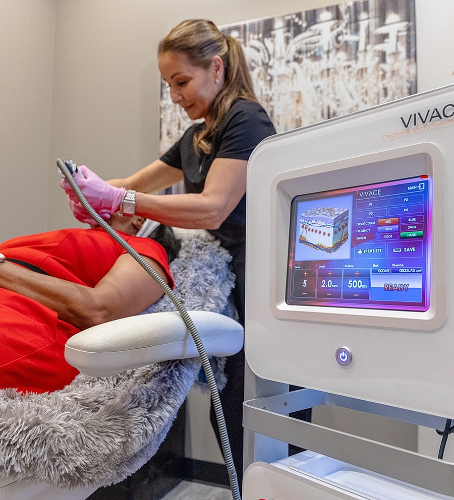 Medical professional performing skincare treatment on patient.