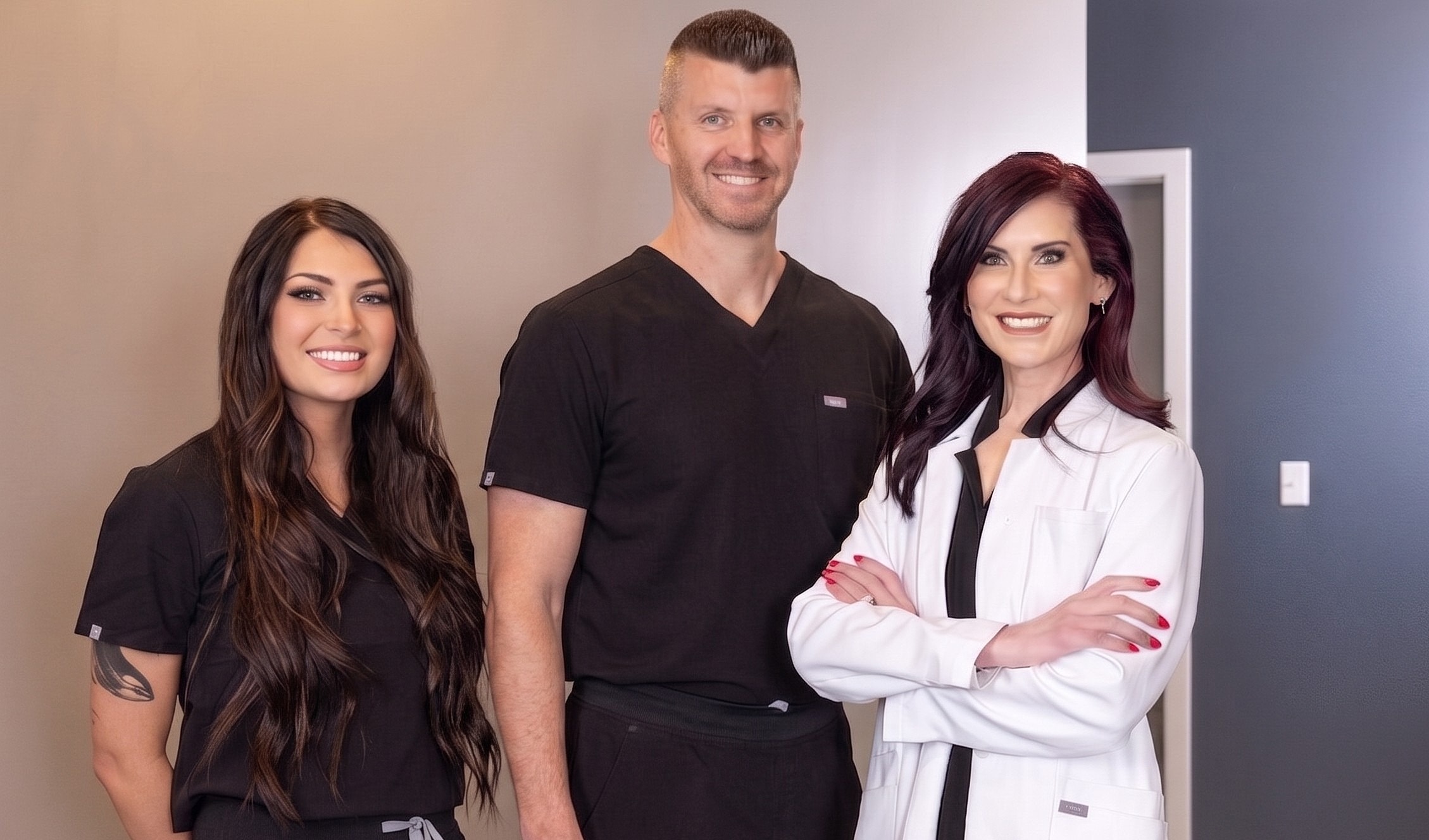 Healthcare professionals posing together in office.